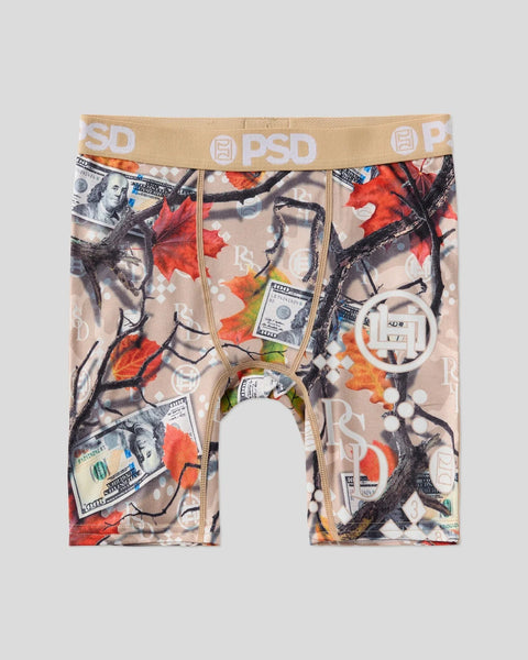 PSD brand boxer briefs with all-over print featuring dollar bills, red maple leaves, black line drawings, and white circular 