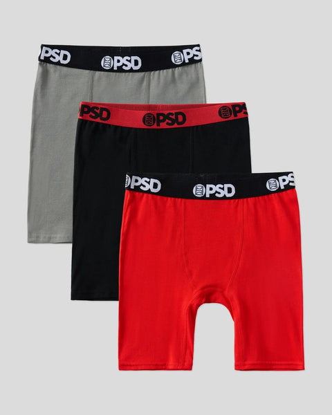 Three boxer briefs in gray, black, and red with PSD branded elastic waistbands.