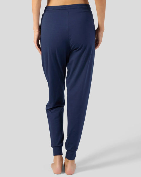 Navy blue joggers with elastic waistband and cuffed ankles, shown from back view.