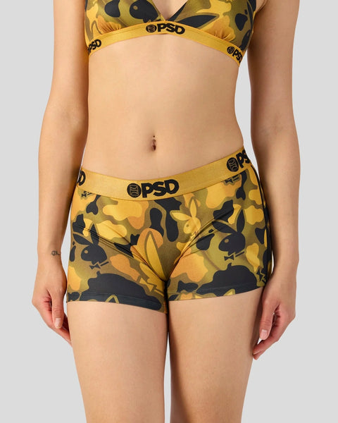 Gold and black bunny print sports bra and shorts set with PSD branding.