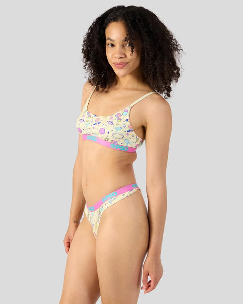 Playboy Iconz two-piece swimsuit with colorful icon print, pink and blue trim, and adjustable straps.