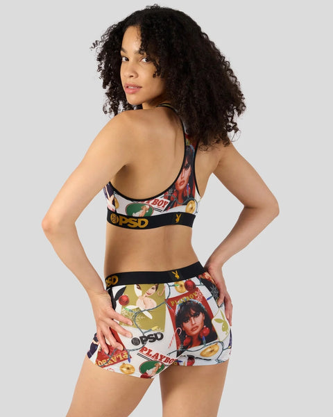 Woman wearing Playboy-branded bra and shorts set with festive print and black elastic bands.