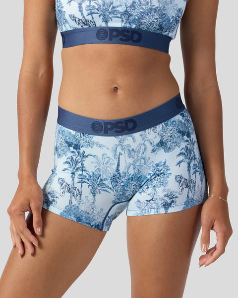 Light blue and white palm print sports bra and matching shorts with navy waistbands.