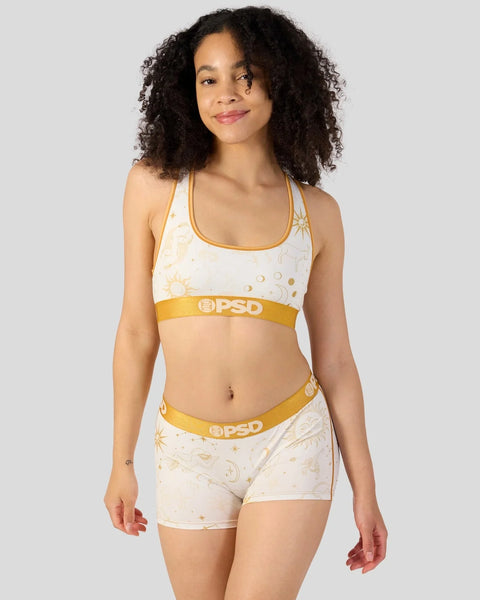 Cream and gold two-piece set with celestial sun and moon print, gold trim, and PSD branding on waistband.