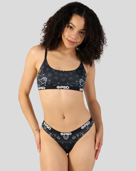 Black bandana-print sports bra and briefs set with white floral details and branded waistband.