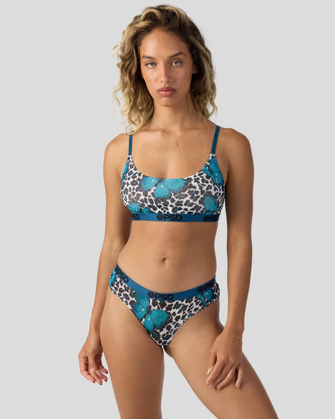 Two-piece swimsuit with turquoise and black leopard print and butterfly motifs, featuring a camisole top and matching briefs.