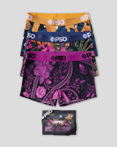 Three PSD boxer briefs in orange camo, navy camo, and magenta floral with branded elastic waistbands.