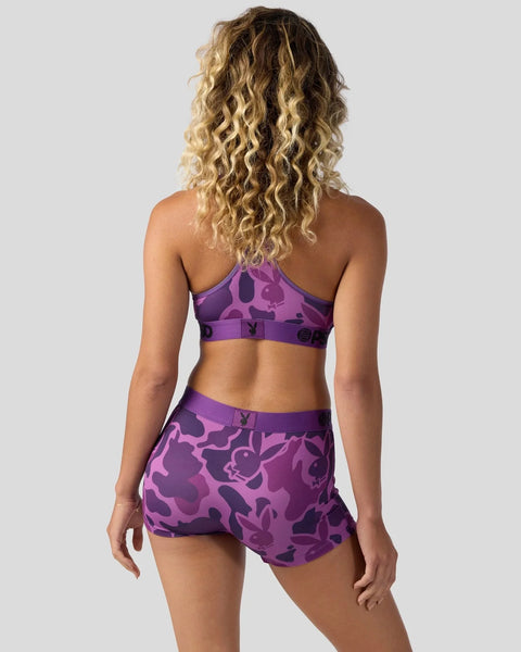 Purple and mauve bunny pattern sports bra and shorts set shown from back view on model.