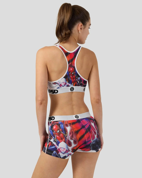 Woman wearing red and blue Spider-Man sports bra and shorts with white trim and logo waistbands.