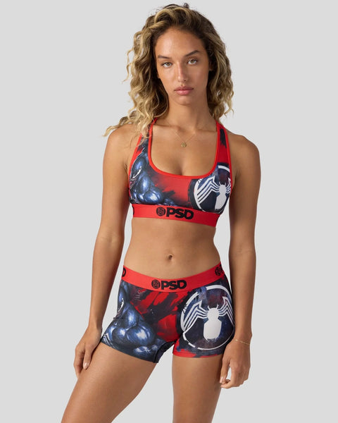 Red and black Venom sports bra and shorts set with character graphics and PSD branding.