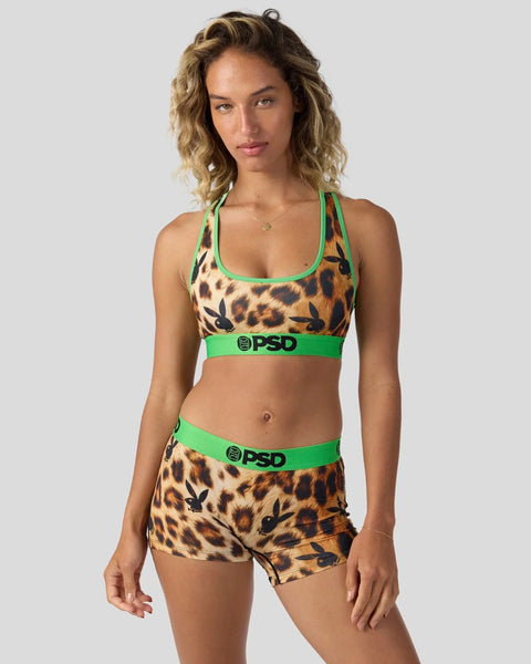 Leopard print sports bra and shorts set with green trim and PSD branding.