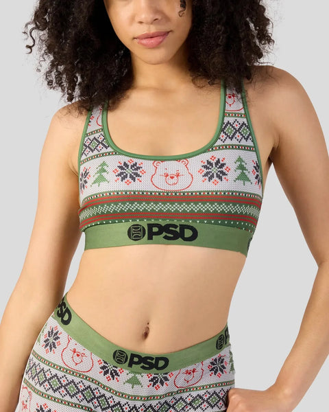 Green and white knit sports bra with Care Bears and snowflake pattern, green trim, and PSD waistband.