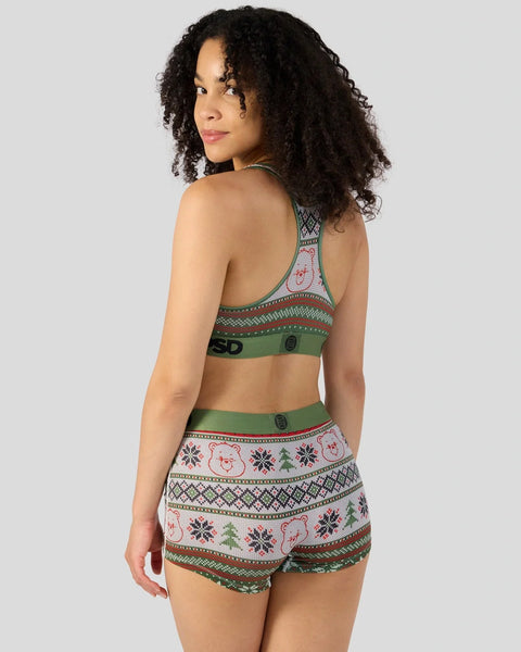 Care Bears-themed sports bra and shorts set with knit pattern featuring bears, snowflakes, and geometric designs in green, re