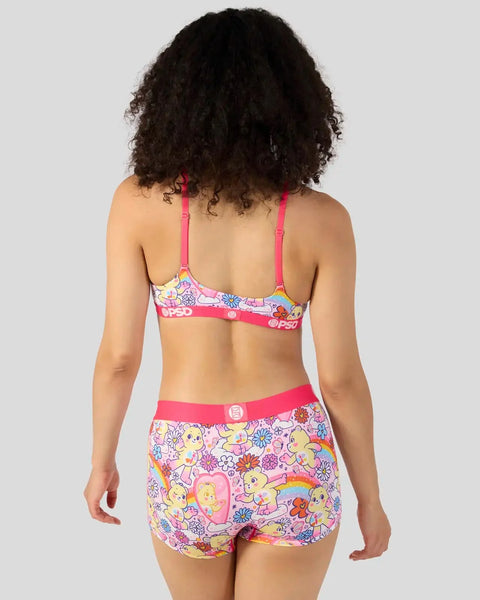 Care Bears print two-piece swimsuit with pink straps and colorful bear and flower design on light background.