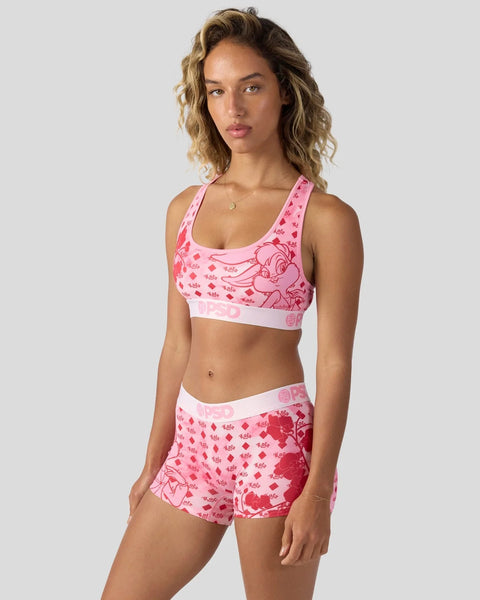 Pink sports bra and shorts set with Looney Tunes character print and branded waistband.