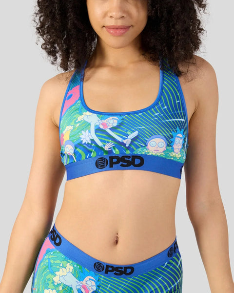 Woman wearing blue PSD sports bra with Rick and Morty characters and colorful striped design.