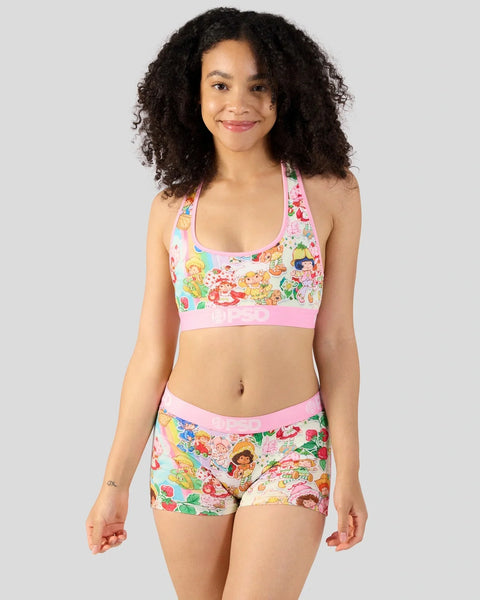 Pink sports bra and shorts set with vintage cartoon character and fruit print design.