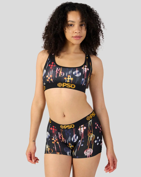 Black sports bra and shorts set with colorful neon graphic print and PSD branding.