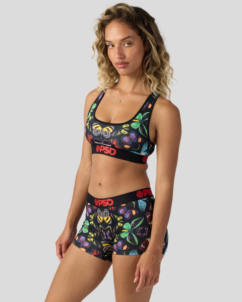 Black sports bra and shorts set with colorful butterfly print and red logo band.