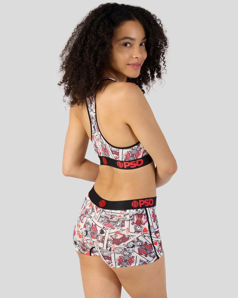 Woman wearing red and white comic-print sports bra and matching shorts with black PSD waistbands.