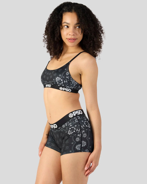 Black sports bra and shorts set with all-over bandana and floral print, PSD waistband branding.