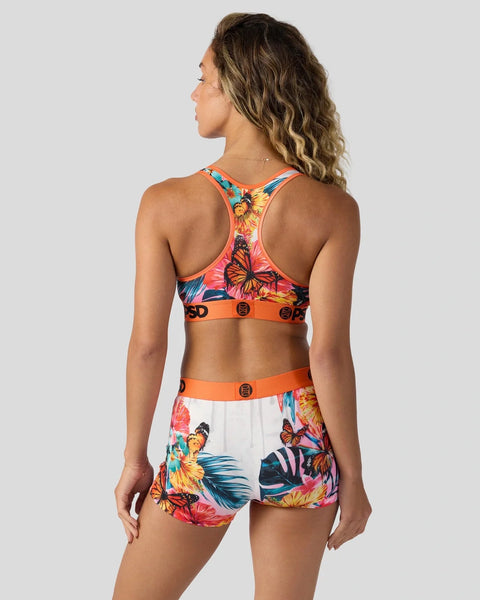 Racerback sports bra and shorts set with tropical butterfly and flower print in orange, pink, and blue.