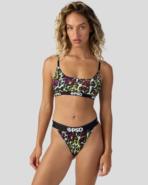 Woman wearing jewel leopard print bra and underwear set with black trim and branded waistband.