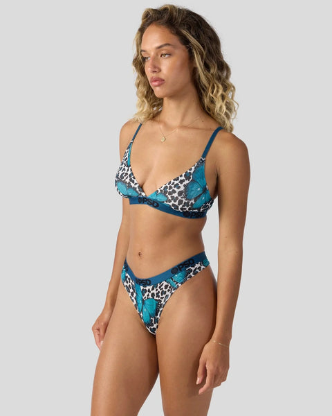 Two-piece swimsuit with teal butterfly and leopard print pattern, adjustable straps and matching bottom.
