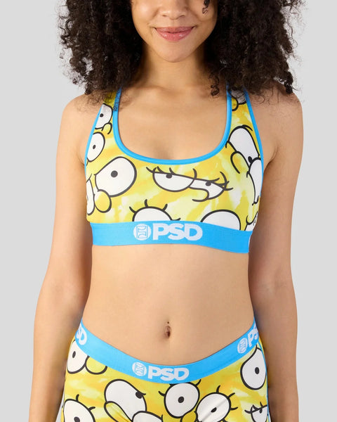 Yellow and blue PSD bikini set with cartoon eyes pattern and blue trim.