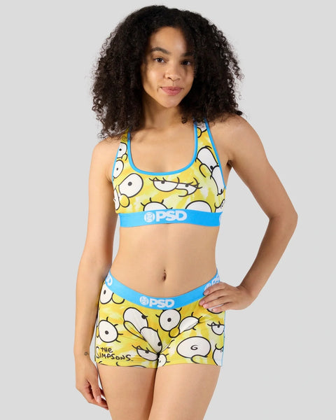 Yellow and blue two-piece swimsuit with large cartoon eyes pattern and blue trim bands.