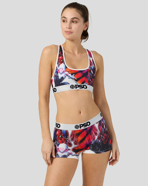 Woman wearing Spider-Man graphic sports bra and matching shorts with PSD waistband in red, blue, and black.