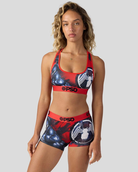 Red and black sports bra and shorts set with Venom character graphics and PSD branding.