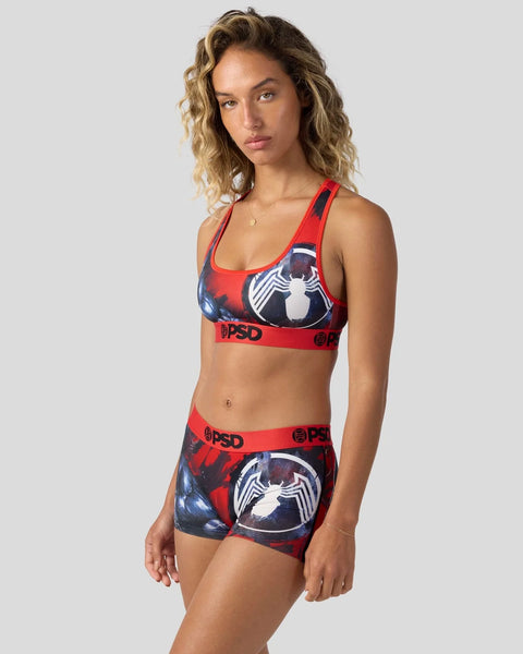 Red and black sports bra and shorts set with white Venom spider logo graphic and PSD branding.