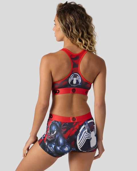 Red and black Venom sports bra and shorts set with character graphic print and button details.