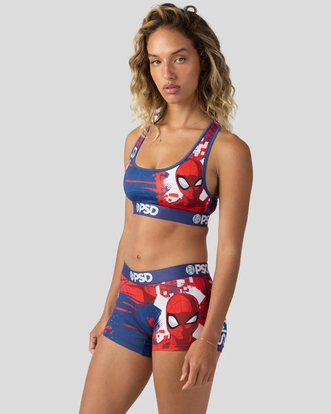 Women's sports bra and shorts set featuring Spider-Man head graphic in red, white, and blue with PSD branding.