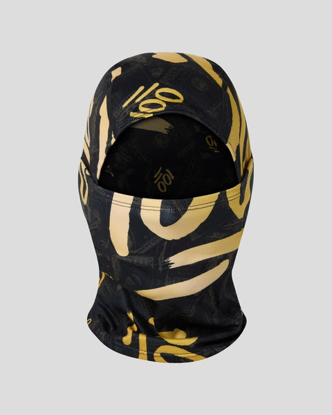 Black and gold balaclava with geometric stripe pattern and signature logo on front panel.