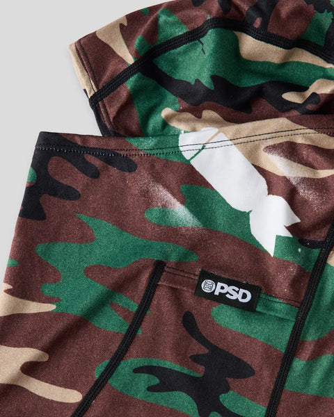 Camouflage bomber jacket in brown, green, and tan with black ribbed trim and PSD brand label visible.