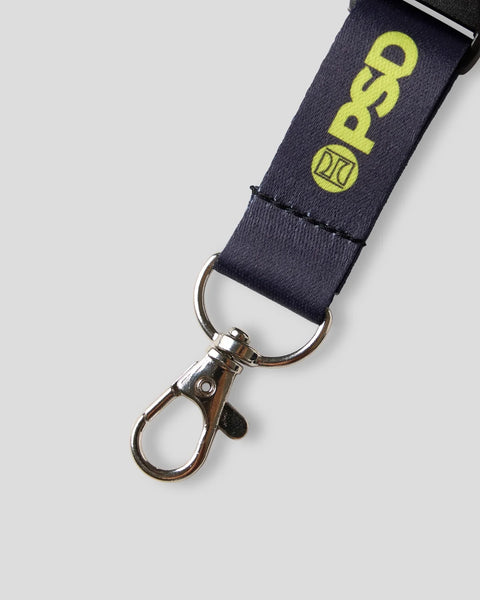 Black lanyard with neon yellow logo and metal clip attachment.