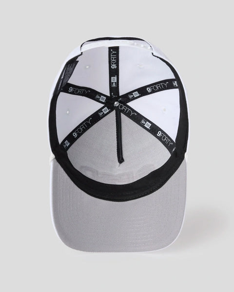 White baseball cap with black visor and back panels, featuring black strap with 9FORTY branding and PSD logo label.