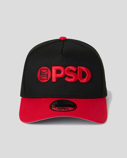 Black and red baseball cap with red PSD logo embroidered on front and red button on crown.