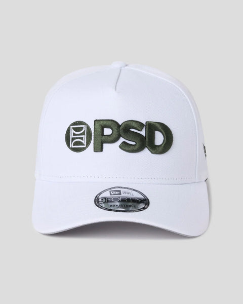 White baseball cap with green and white embroidered PSD logo on front and New Era branding on back.