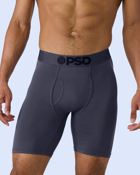 Dark purple modal boxer briefs with PSD waistband, shown on male model from waist to mid-thigh.
