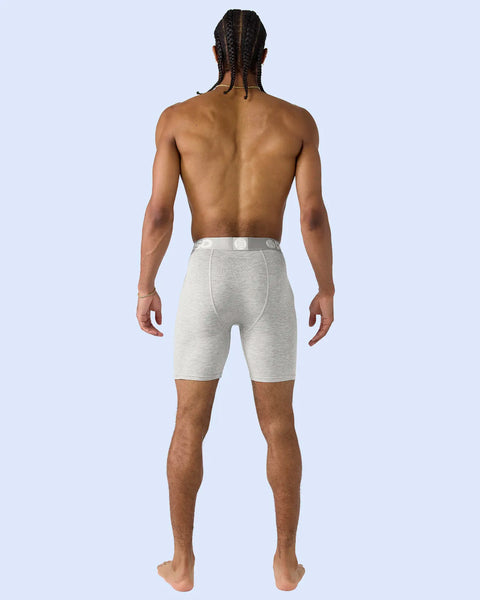 Heather gray shorts with elastic waistband worn by man shown from back.