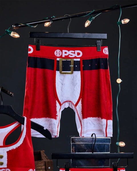 Red and white PSD boxer briefs with Santa suit design, gold buckle belt detail, and black waistband, displayed on hanger with