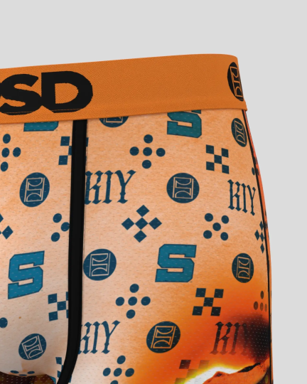 Flared underwear with orange waistband and tan fabric printed with blue geometric patterns and text.