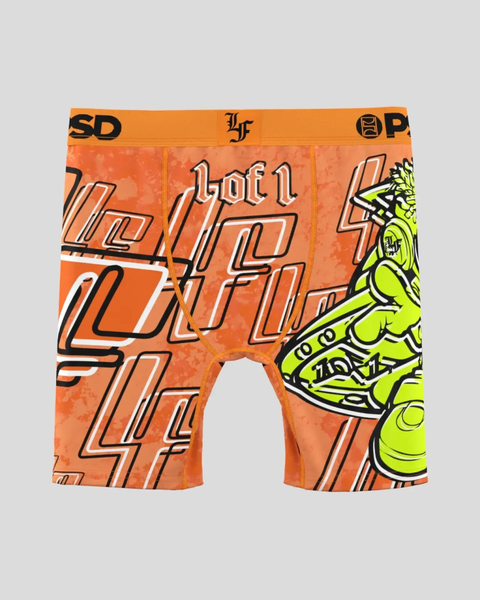 Orange boxer briefs with black and white geometric lettering, neon yellow alien graphic on right leg, and orange waistband.