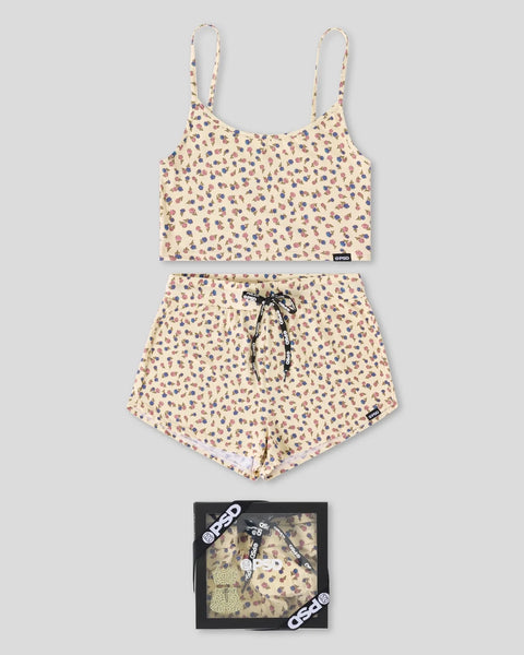 Cream cami top and shorts sleep set with multicolor scattered print, drawstring shorts, displayed flat with packaged set belo