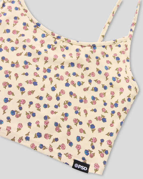 Cream cami top with all-over pink and blue floral print and thin shoulder straps.