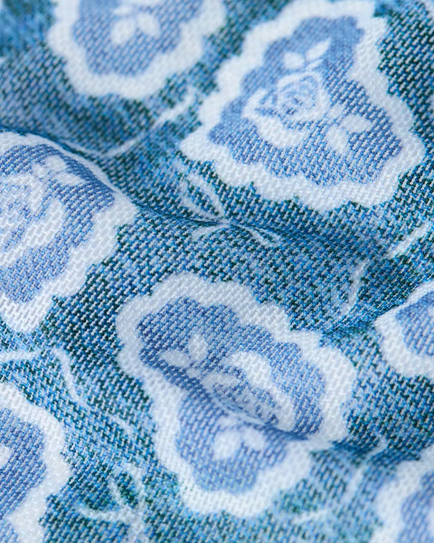 Blue and white mesh fabric with repeated floral pattern detail.