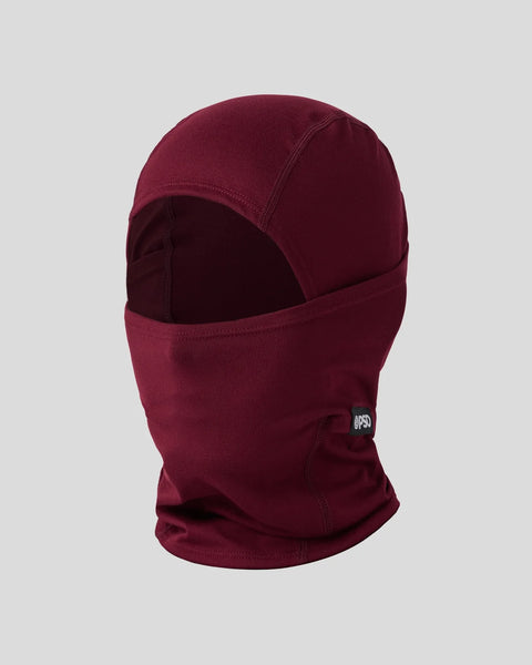 Dark burgundy balaclava with full face coverage and small branded patch on lower front.
